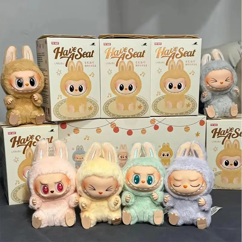 Labubu Plush toys and boxes with 'Have a Seat' branding on a gray background