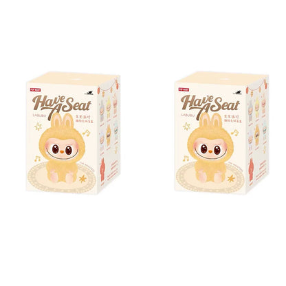Two boxes of 'Have Seat' Labubu plush toys on a white background