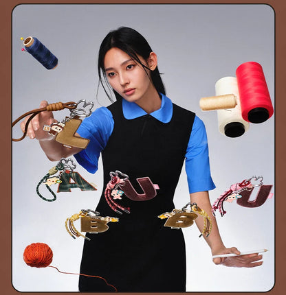 Labubu Pin for Love. Woman holding various sewing tools and materials with a gray background
