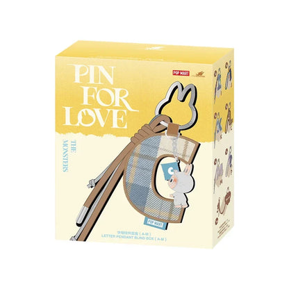 Labubu Pin for Love. Product packaging for 'Pin for Love' with a yellow and beige design.