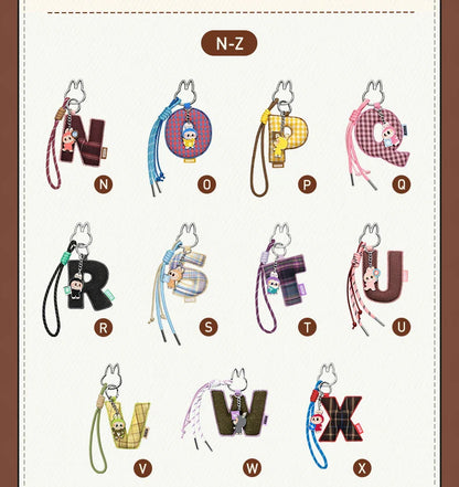 Labubu Pin for Love. Alphabet keychains from N to Z on a white background with a brown border.