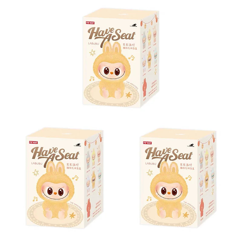 Three boxes of 'Have A Seat' Labuu with cartoon character design on a white background